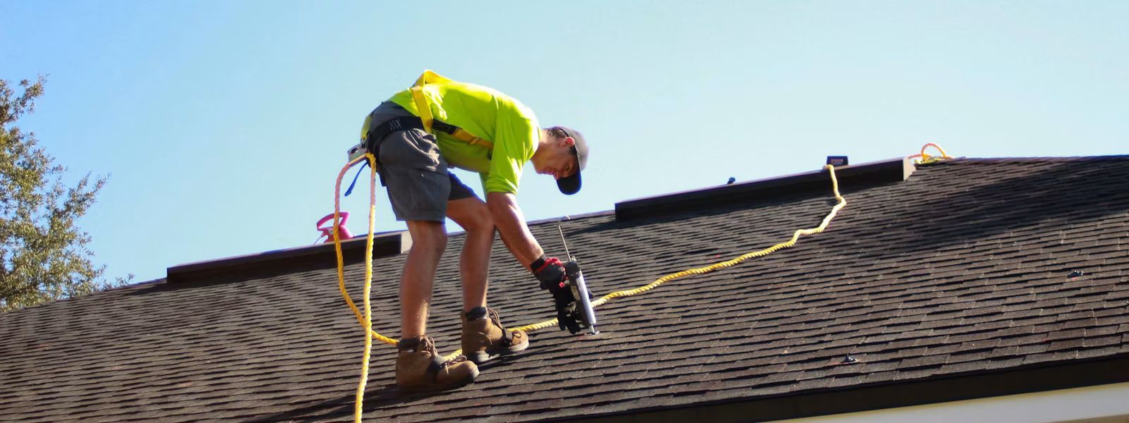 Roof repair in Maryville, TN - roofing contractor replacing shingles on a residential roof - Heavy D