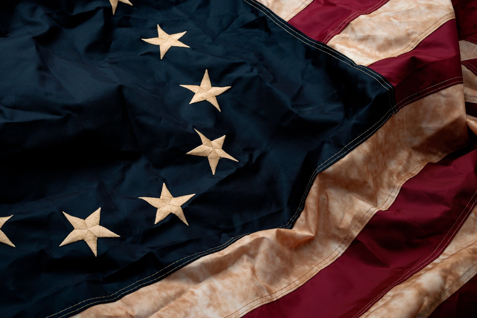 A close up of an american flag with stars on it.