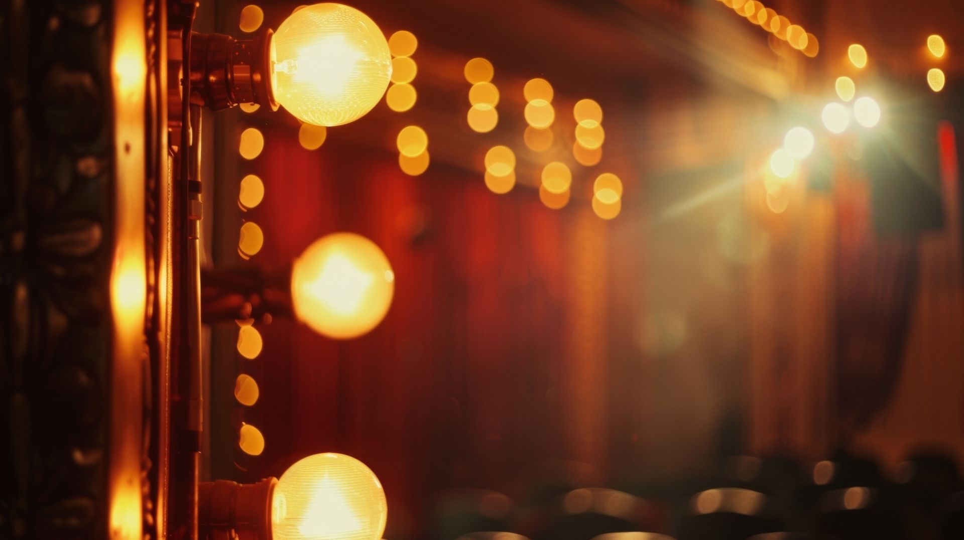 A stage with a red curtain and a lot of lights on it.