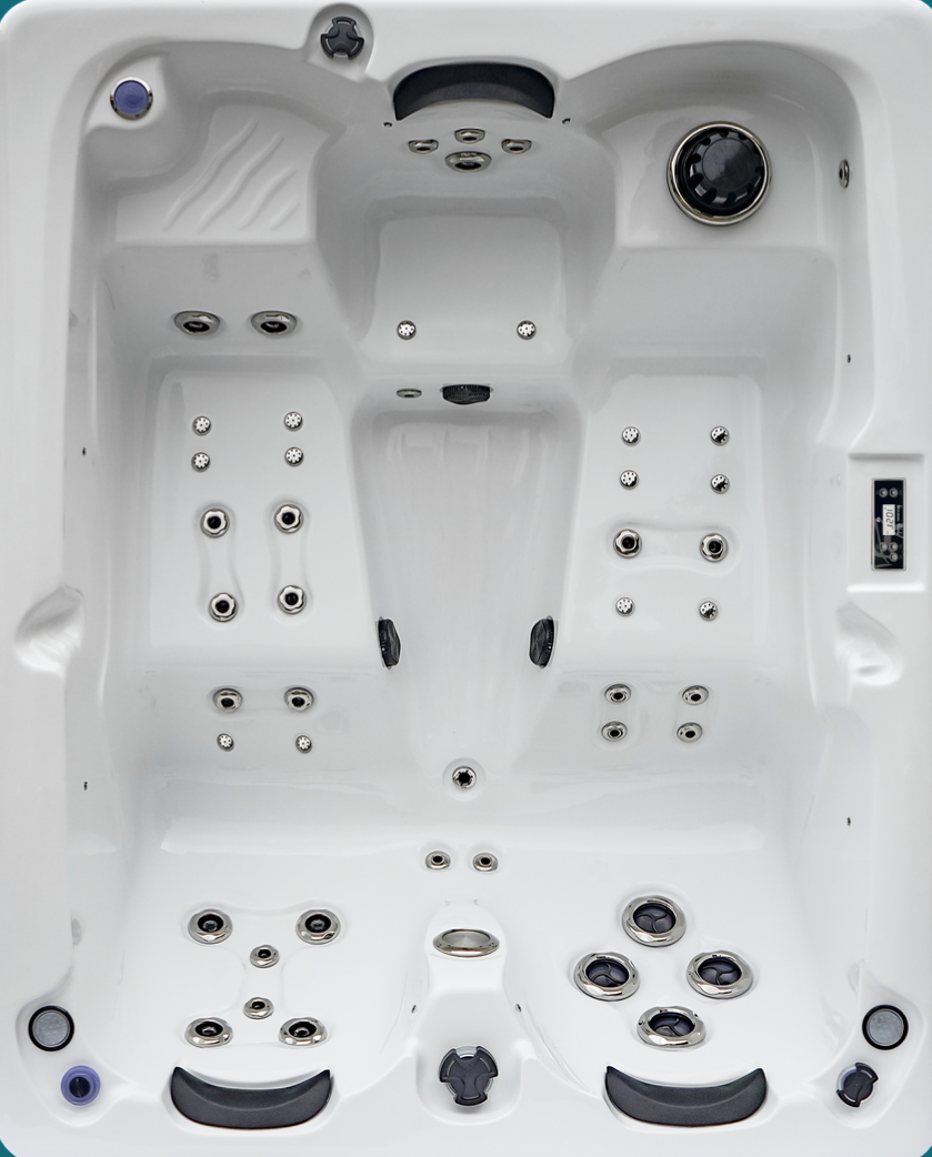 Un jacuzzi blanc avec de nombreux jets et un thermostat