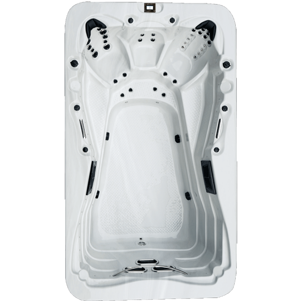 Une piscine blanche avec beaucoup de jets dessus.