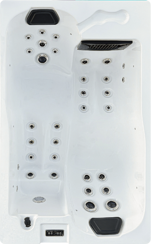 Un jacuzzi blanc avec beaucoup de boutons dessus.