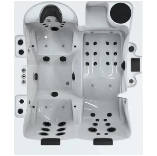 Un jacuzzi blanc avec des points noirs dessus est posé sur une surface blanche.