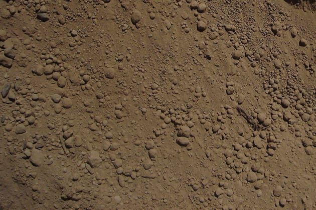 A close up of a pile of dirt and rocks.
