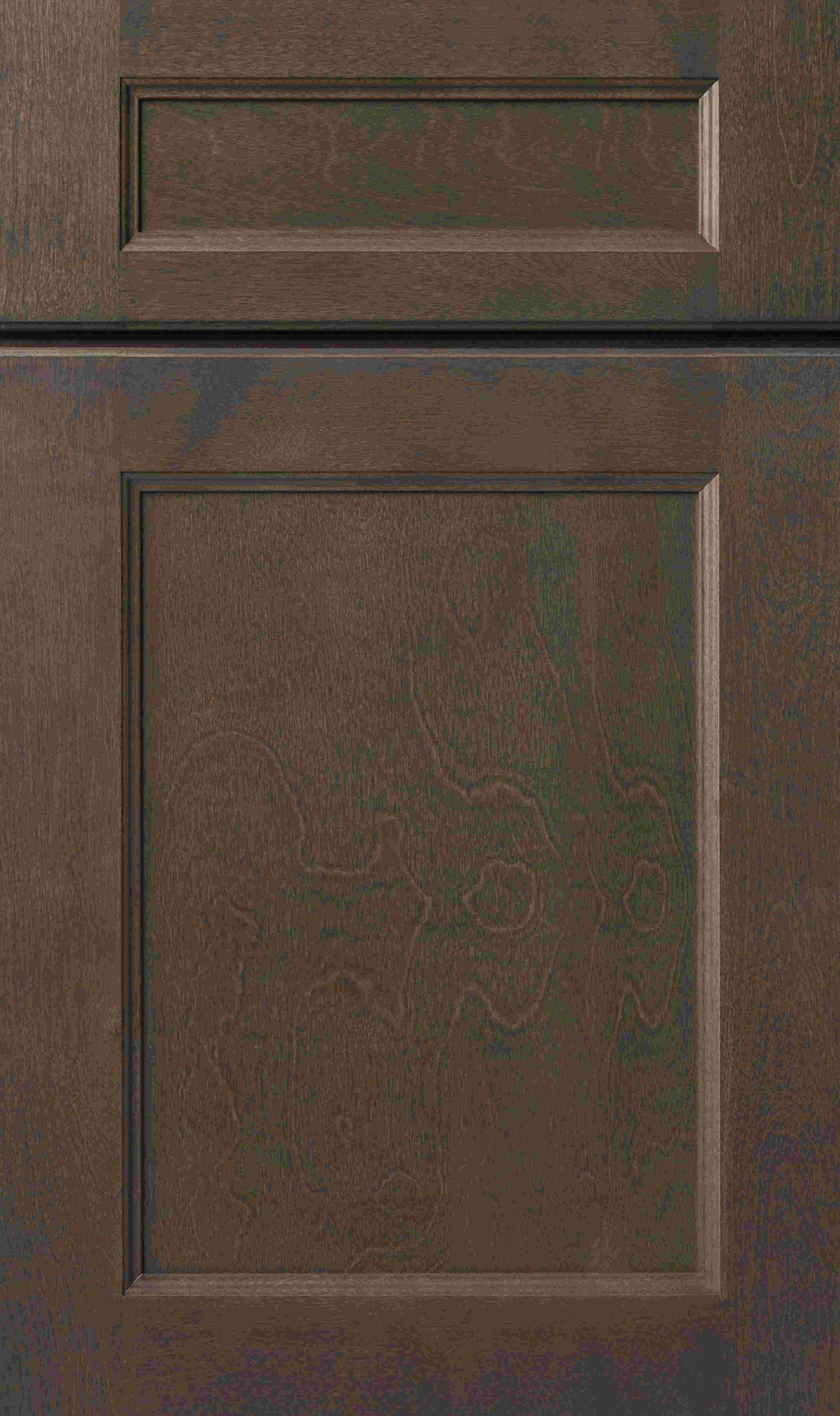 Close-up of a dark brown kitchen cabinet door with a raised square panel and rectangular accent above.