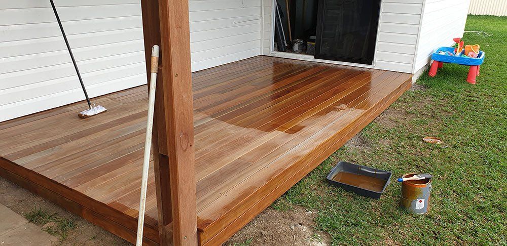 On Going Paint of Wooden Deck — Licensed Builders in Rockhampton, QLD