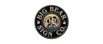 Circular logo for Big Bear Sign Co., featuring a bear silhouette, paw prints, and text against a mountain backdrop.