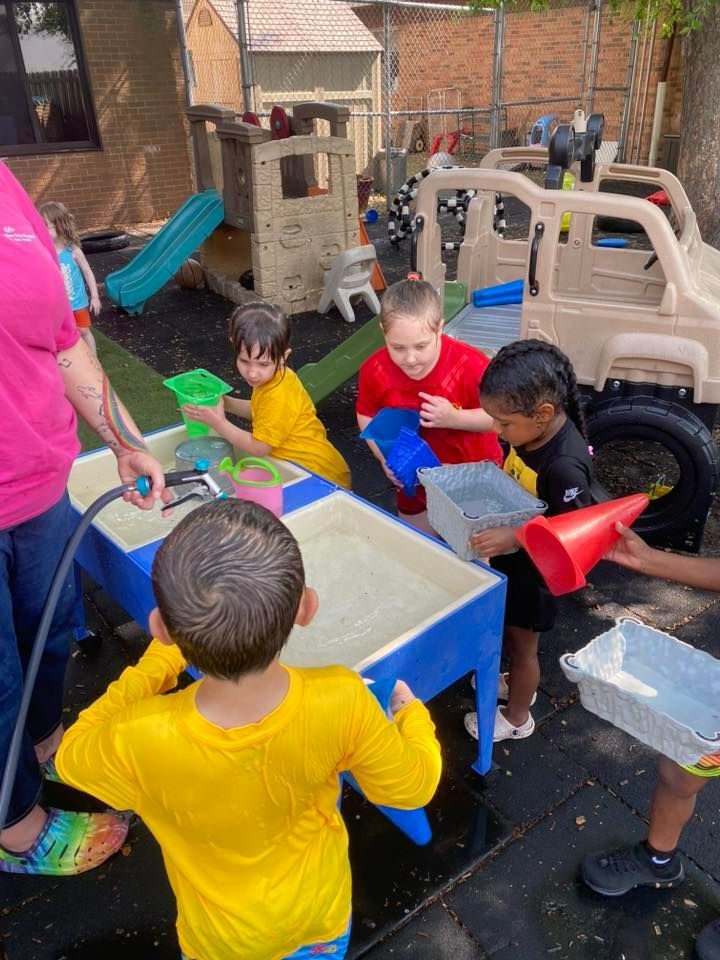 two and children and one teacher - child learning center in Moline IL two and children and one teacher - child learning center in Moline IL