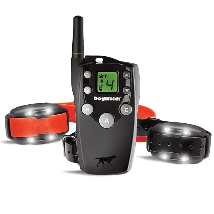 A dog collar with a remote control and two collars on a white background.