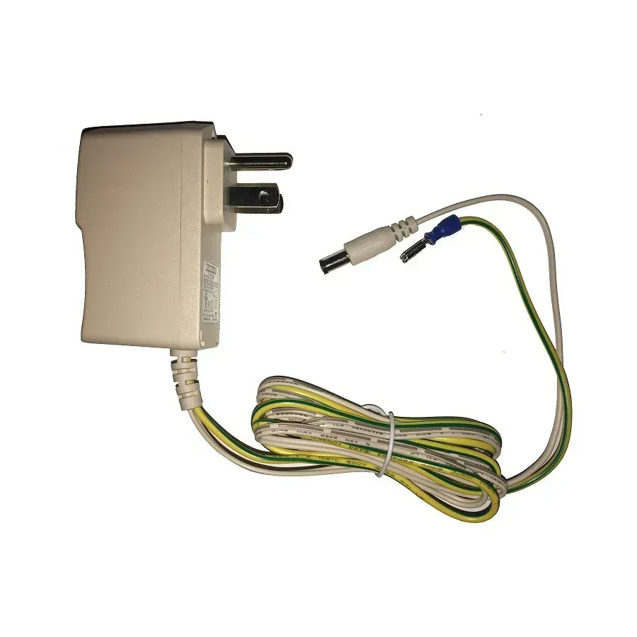 A white charger with a yellow and green cable attached to it.