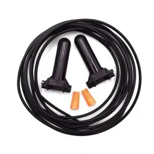 A close up of a black wire with two connectors on a white background.