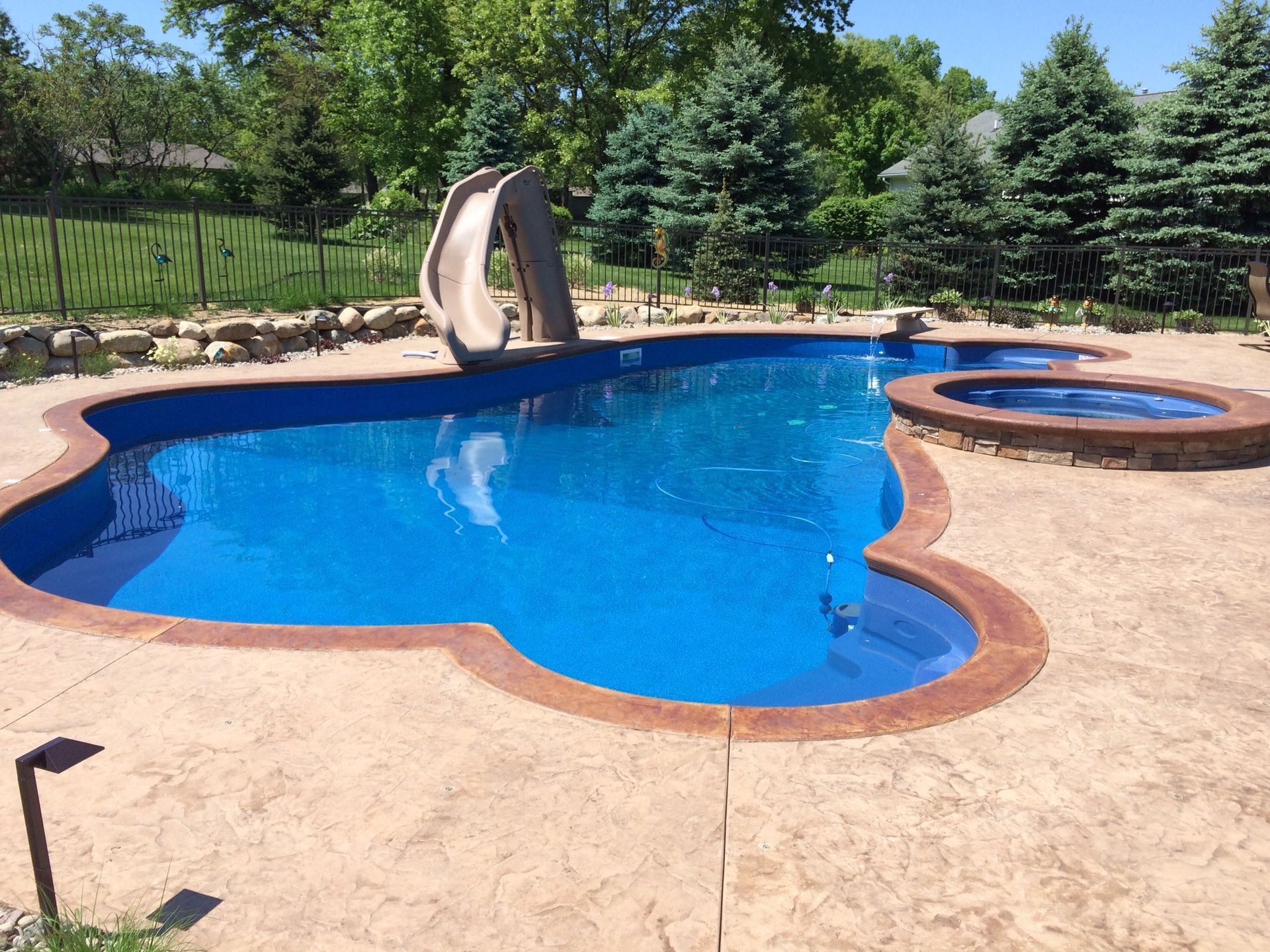 Outdoor In-ground pool with slide