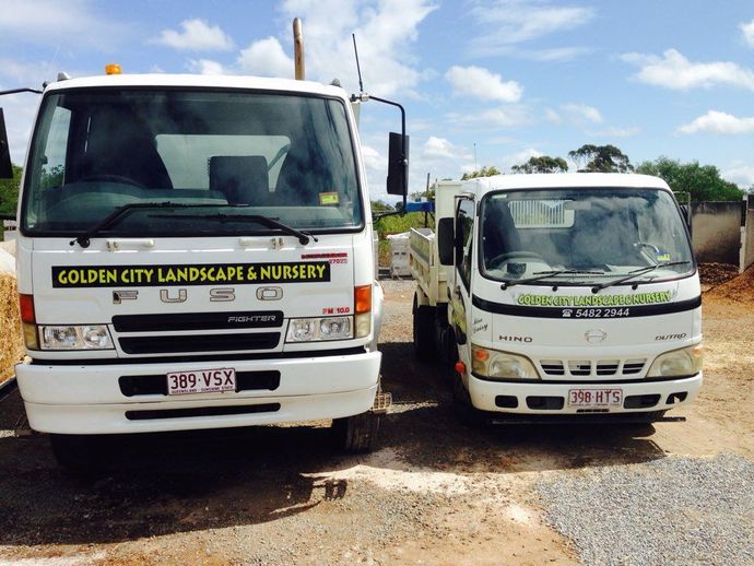 Two Parked White Trucks  — Golden City Brick & Landscape in Gympie, QLD