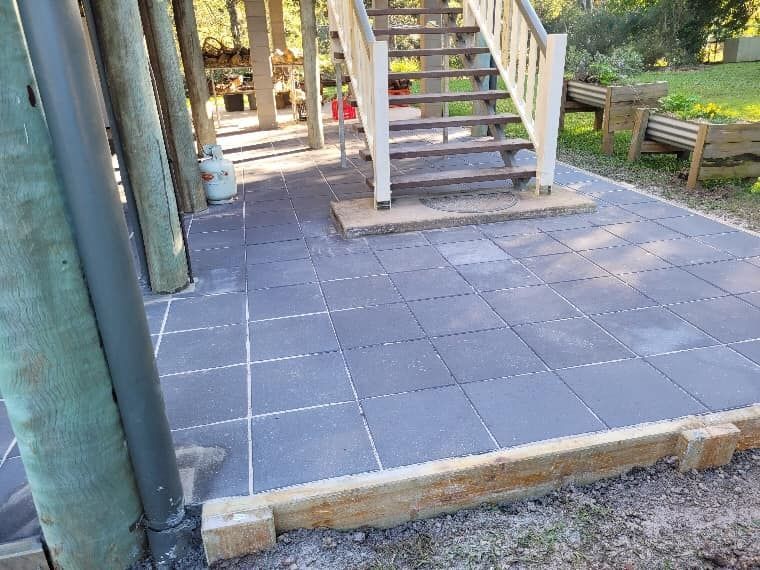 A Patio With Stairs Leading Up to a House — Golden City Brick & Landscape in Gympie, QLD