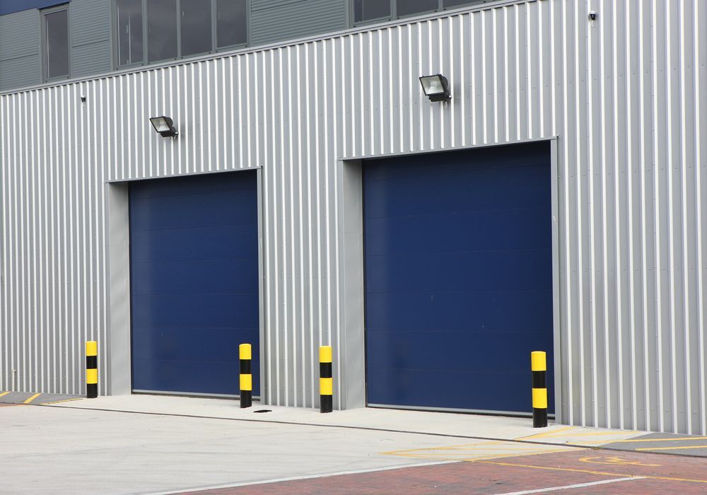 Two Storage Units on a Corrugated Metal Building, Each With Protective Bollards — King Street Storage Emerald in Emerald, QLD