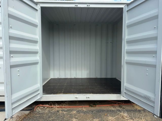 Two Beige Roll-up Storage Unit Doors on a Grey Metal Building — King Street Storage Emerald in Emerald, QLD