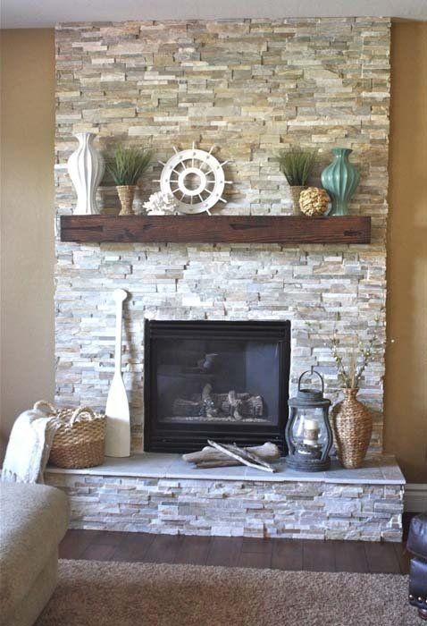 A living room with a fireplace and a shelf above it.