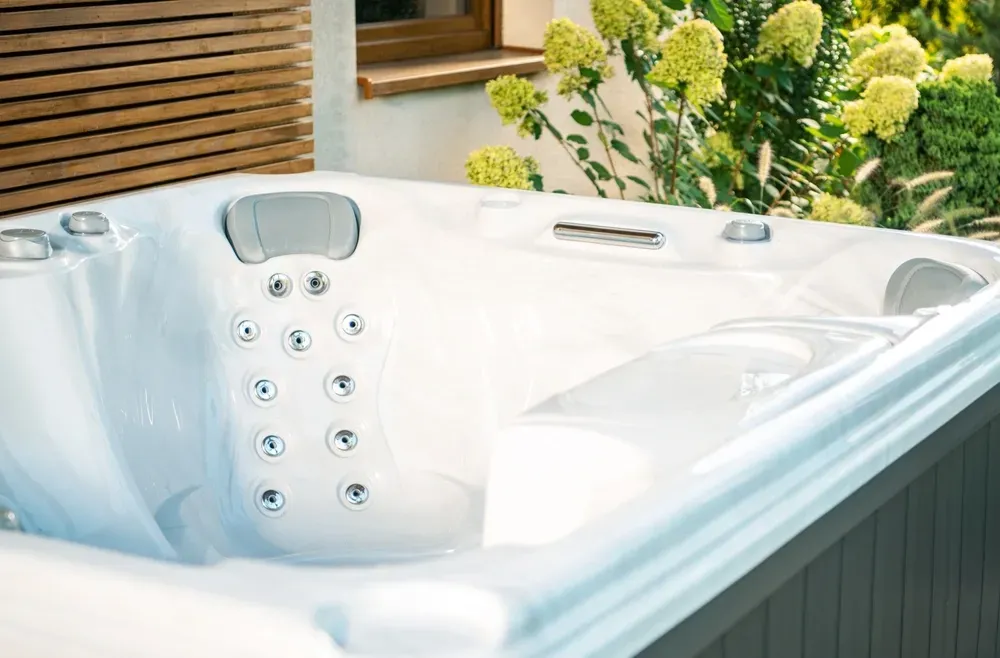 A White, Multi-jet Hot Tub With Built-in Headrests Sits — Sun Cool Pools & Spas in Gympie, QLD