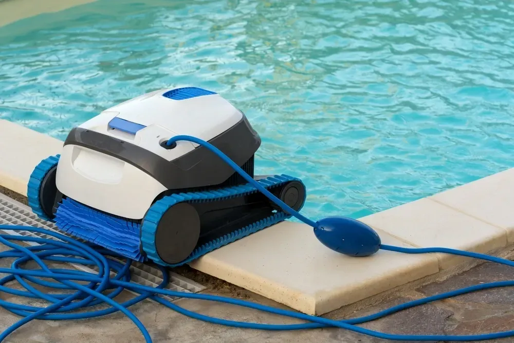 A Robotic Pool Cleaner With Blue Tracks and a Blue Brush — Sun Cool Pools & Spas in Maryborough, QLD