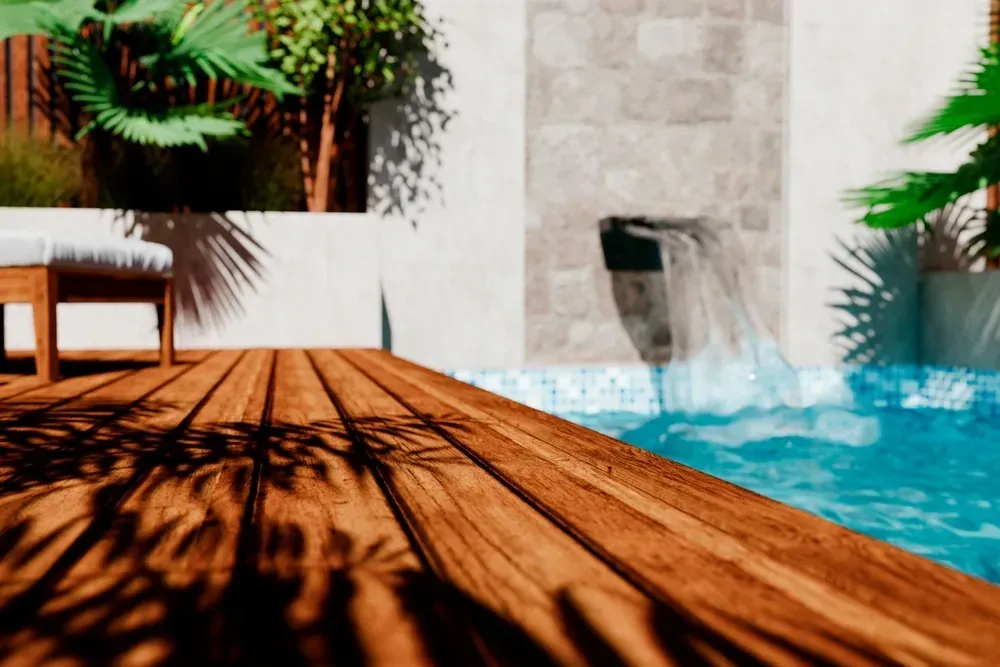 A Wooden Deck Beside a Small Swimming Pool — Sun Cool Pools & Spas in Maryborough, QLD