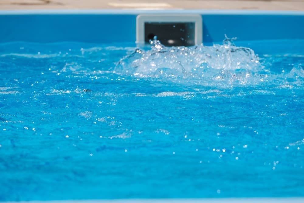 A Close-up of Turbulent, Bright Blue Swimming Pool Water — Sun Cool Pools & Spas in Maryborough, QLD