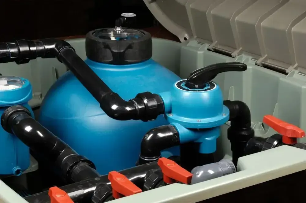 Blue Pool Sand Filter System With Black Piping and Multiple Red Valve Handles — Sun Cool Pools & Spas in Maryborough, QLD