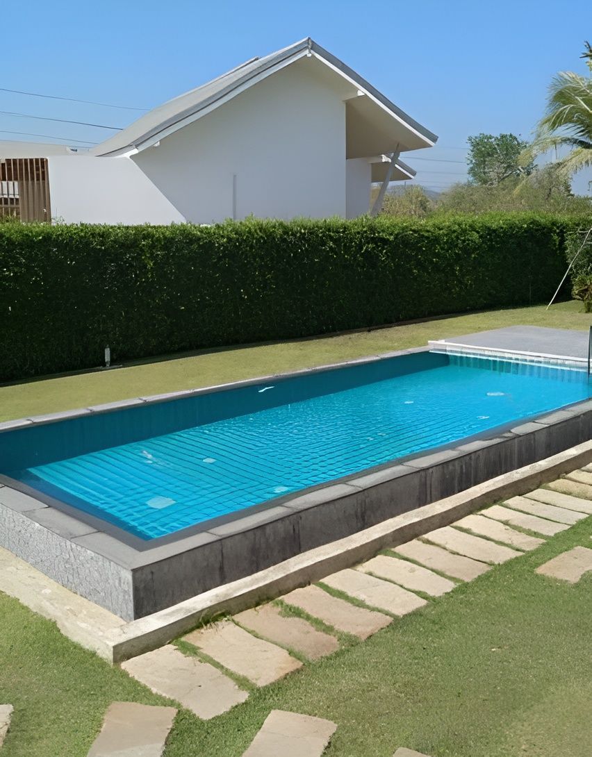 A Rectangular Swimming Pool With Bright Blue Water — Sun Cool Pools & Spas in Maryborough, QLD