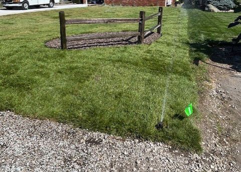 Sprinkler Spraying Water On House Lawn — LaSalle, ON — Yard-Worx