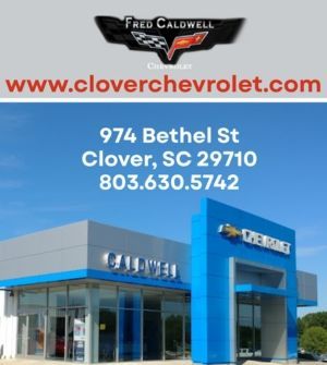 Clover Chevrolet dealership exterior with website, address, and phone number on blue building signage