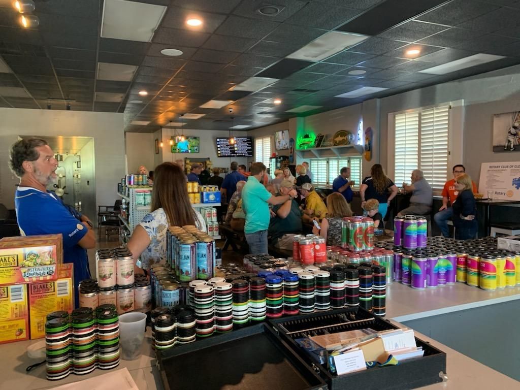People browsing colorful products in a bright store with shelves and checkout counter