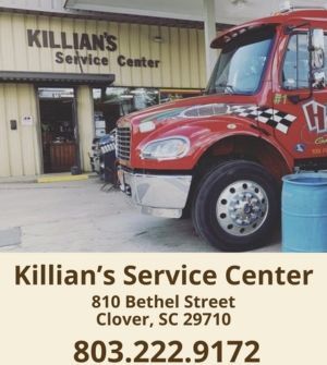 Killian’s Service Center storefront with a red truck parked outside and business address shown.