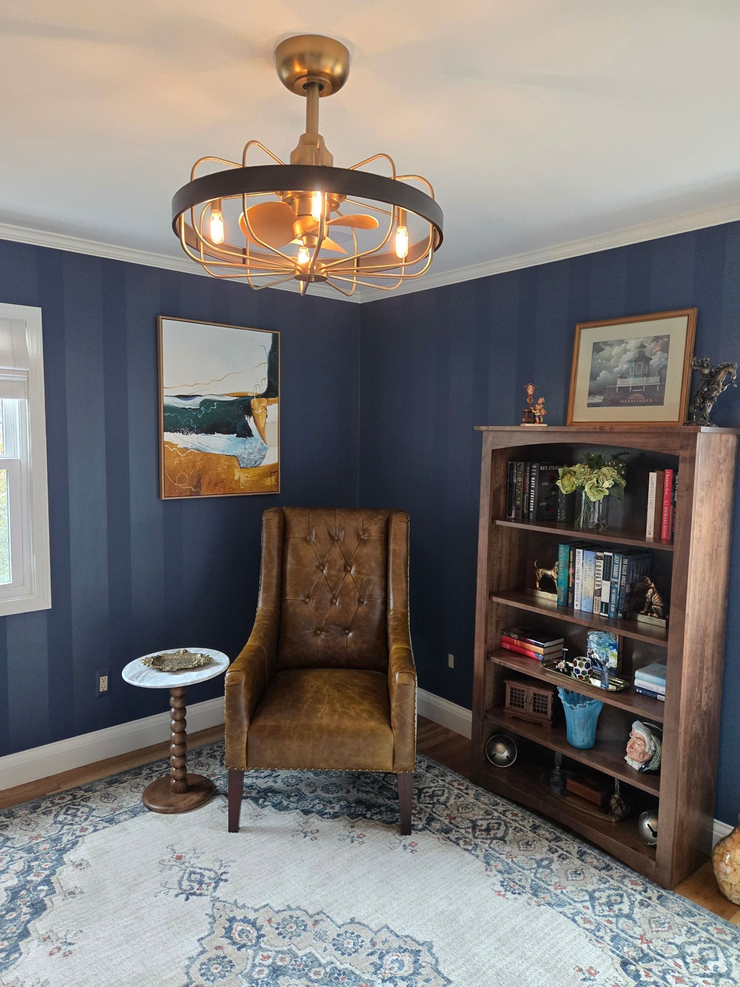 a vanity with a mirror and ottoman in a bathroom interior decorating project