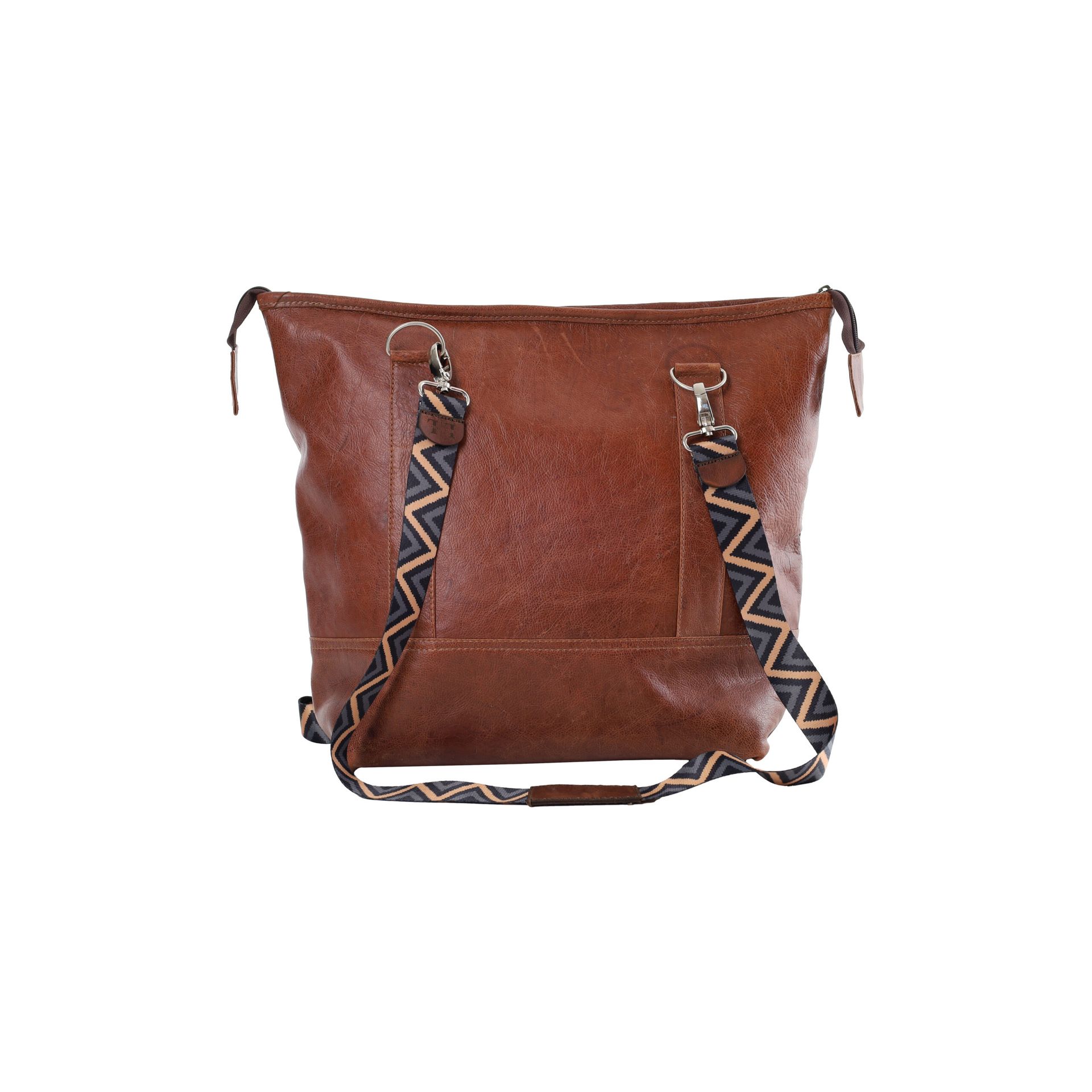 Brown leather shoulder bag with patterned straps on a white background