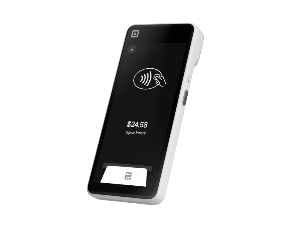 Black handheld payment terminal with contactless tap icon and a $24.56 amount displayed