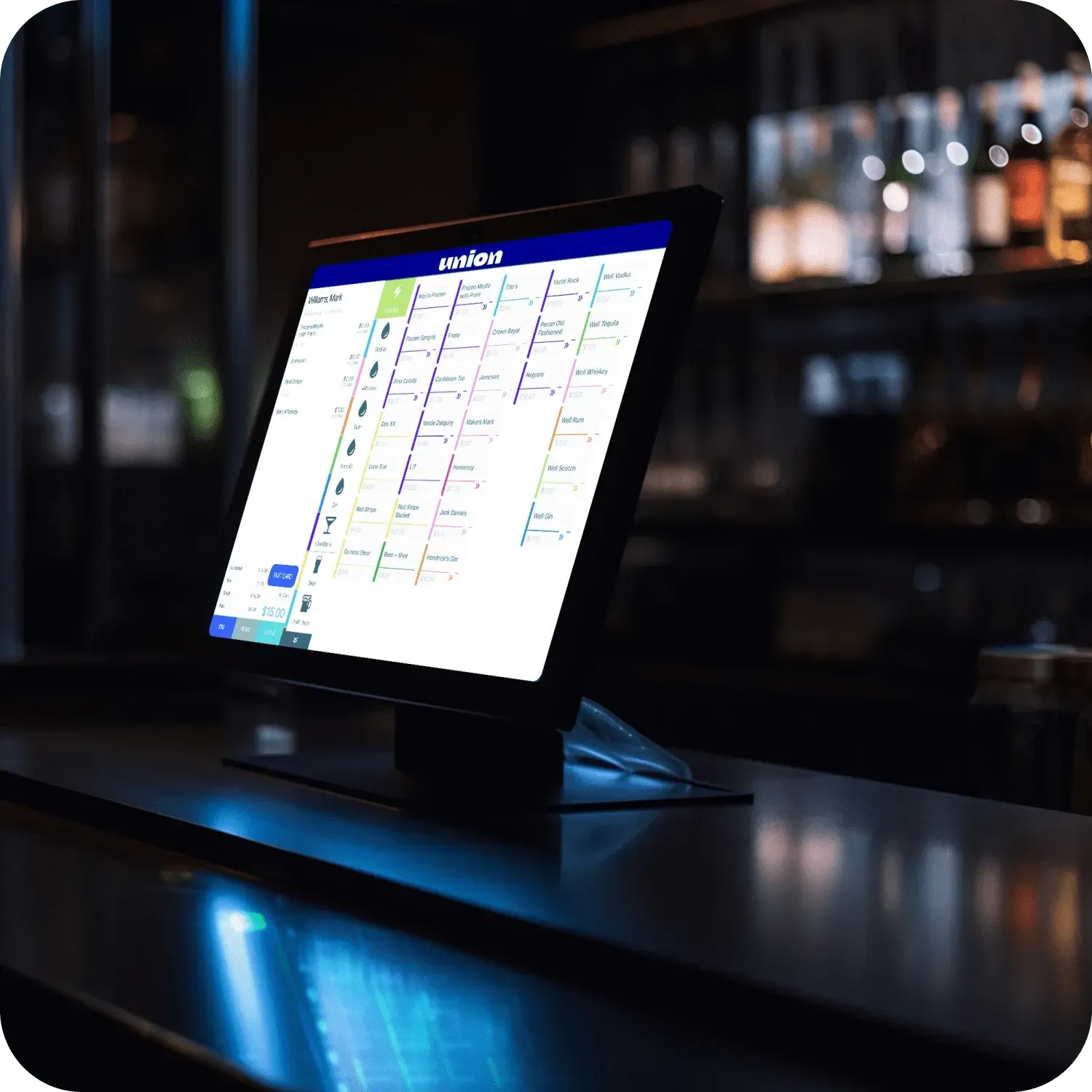 Tablet on a bar counter displaying a scheduling app in a dimly lit restaurant interior