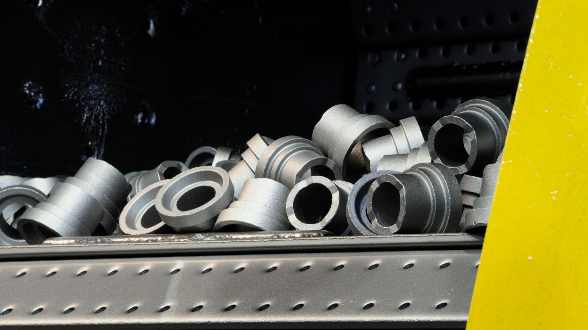 Bin full of metal materials.