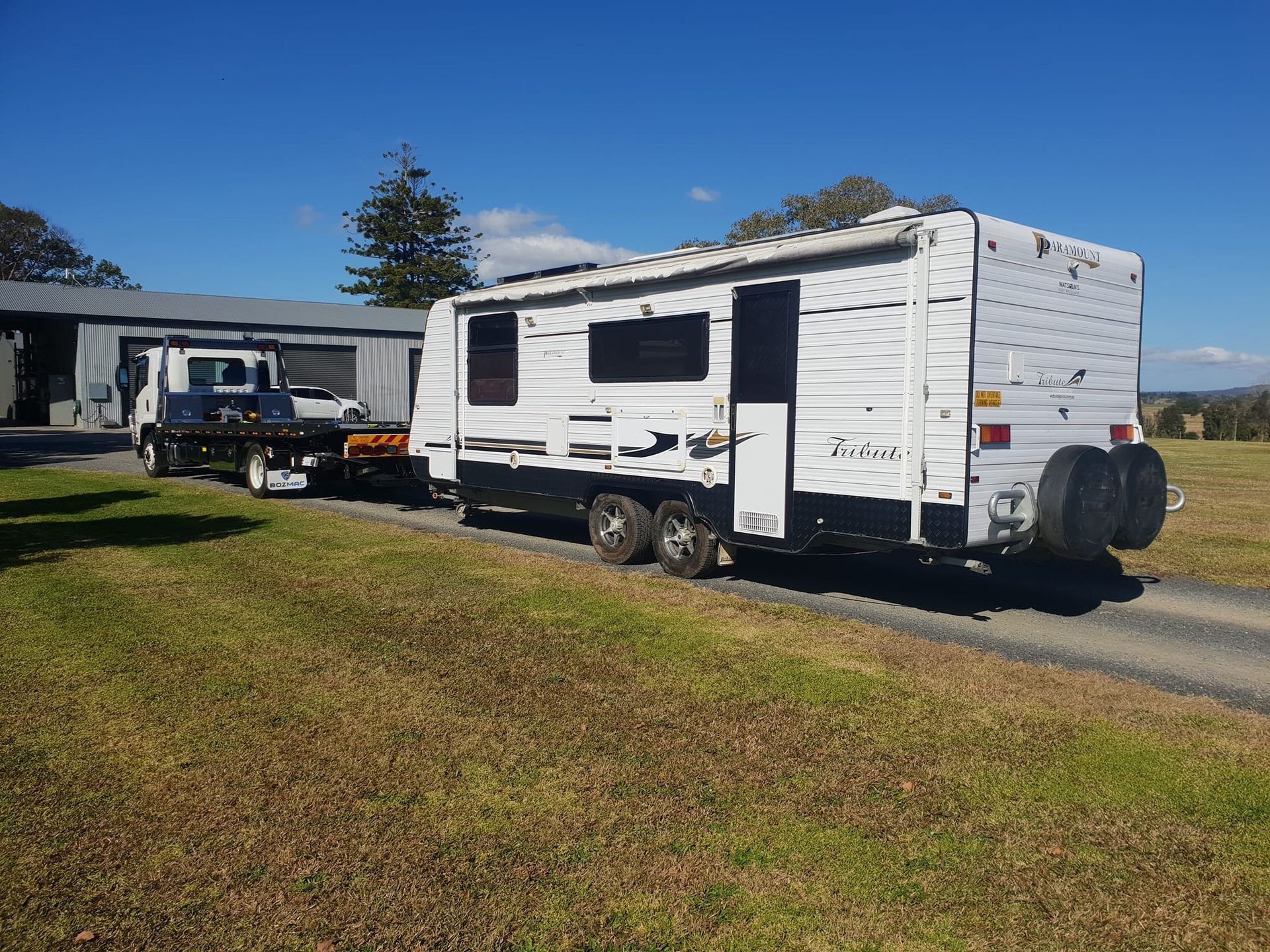 A White Trailer Is Being Towed By A Tow Truck — KTM Towing In Kempsey, NSW