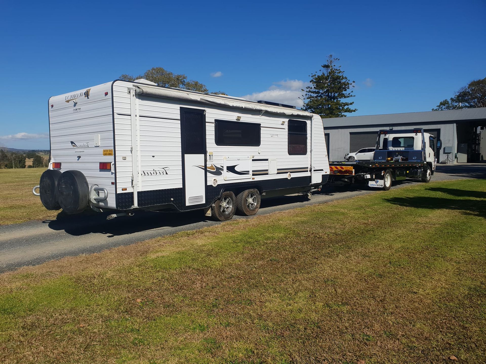 A White Trailer Is Being Towed By A Tow Truck — KTM Towing In Kempsey, NSW