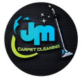 JM Carpet Cleaning logo with blue and lime text, sparkling accents, and a vacuum on a black textured background
