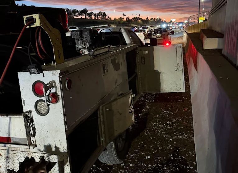 a man is working on a rv battery .