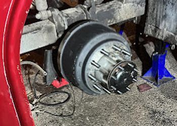 A close up of a brake drum on a truck.