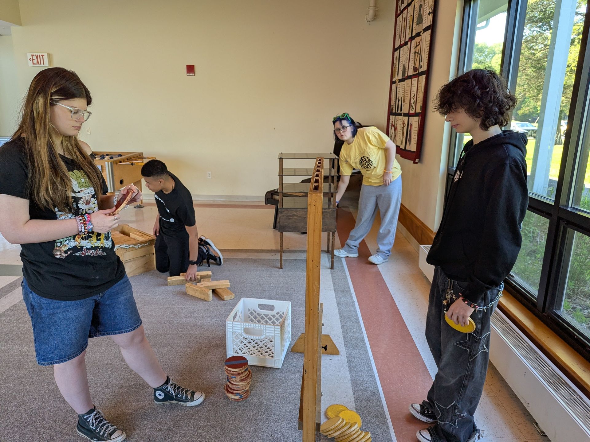 Four people in a room playing games