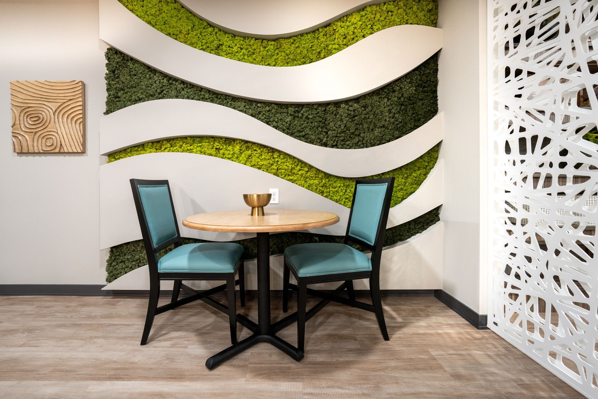 table seating with live green wall
