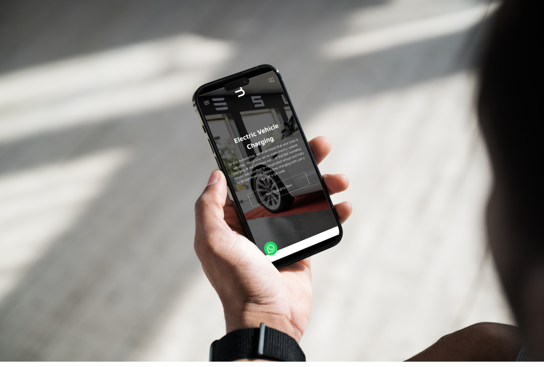 a person is holding a cell phone in their hand .