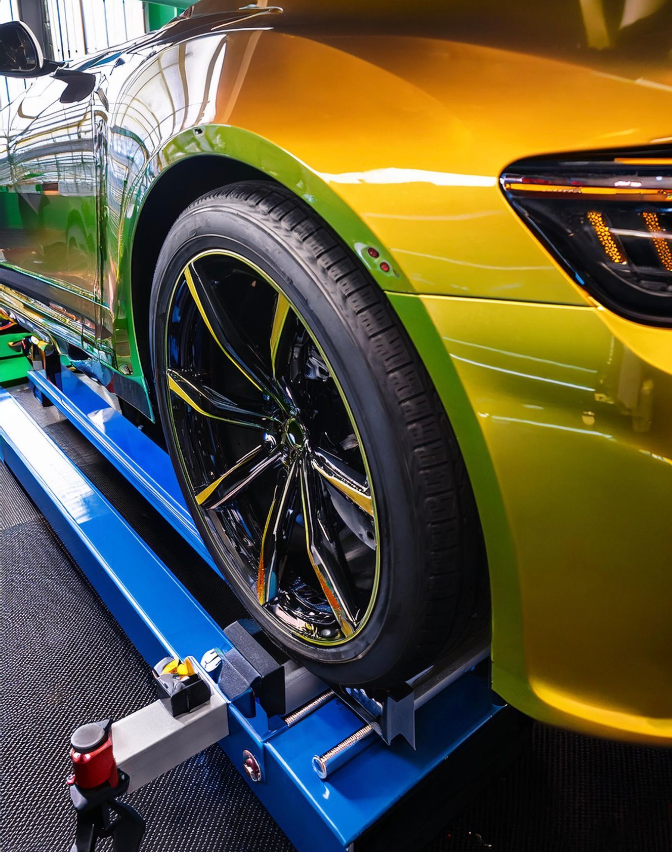The image shows a Chevrolet-like vehicle racked on our mechanics auto repair & service rack in Redwood City, CA.
