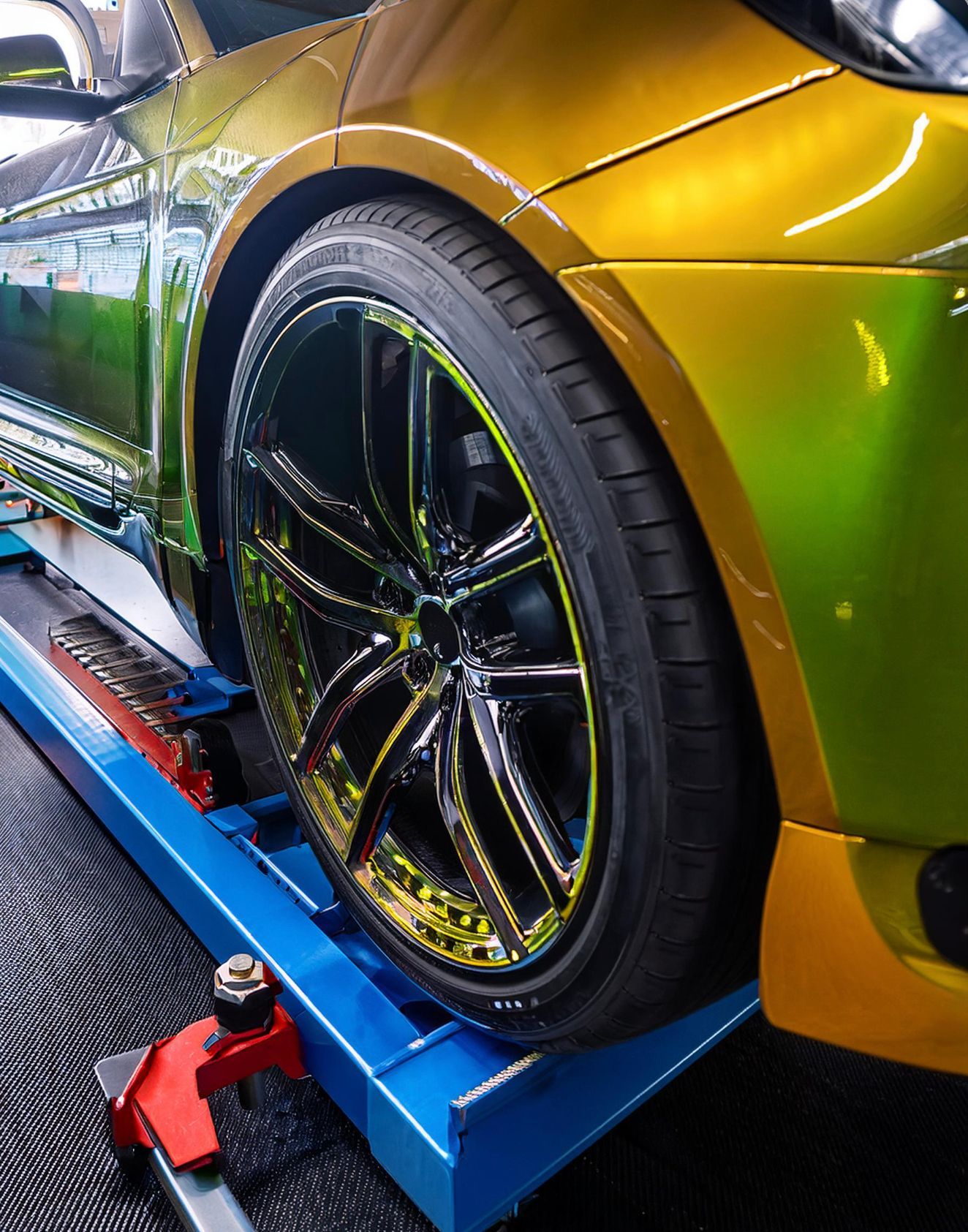 The image shows a Lexus like vehicle racked on our mechanics rack in preparation for auto repair and maintenance service at our auto repair facility in Redwood City, CA.