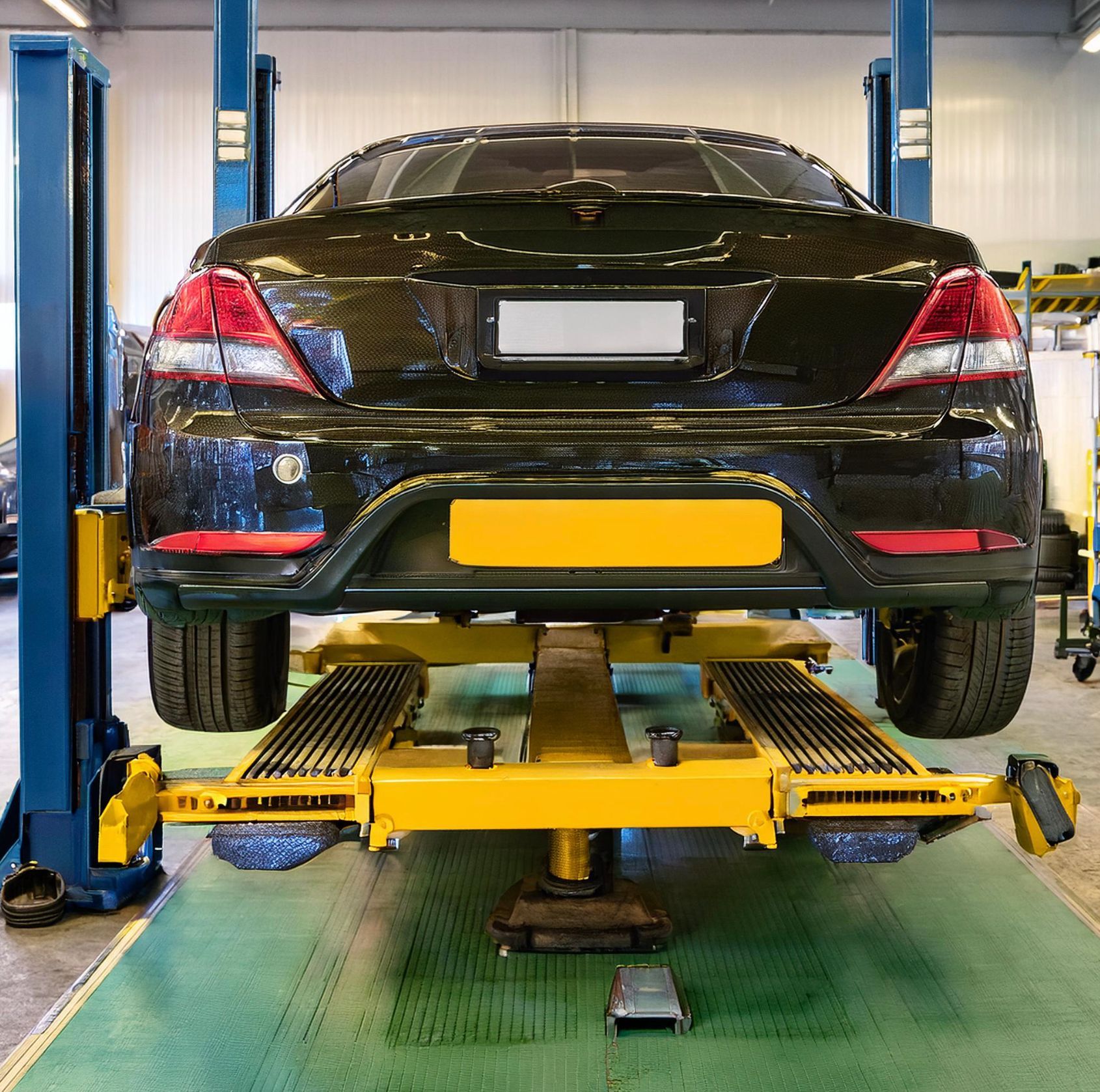 The image shows a Saturn like vehicle rack on our mechanic's rack in Redwood City, CA for auto repair and service.