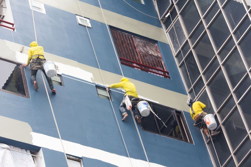 Skilled Painters Applying Colour to Building Walls with Precision — Painters in Denman, NSW