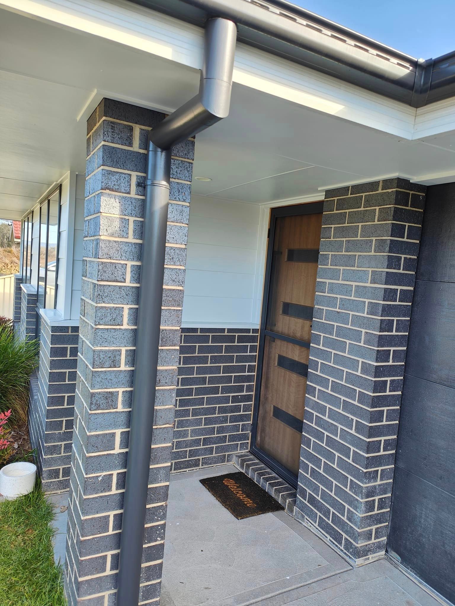 Man painting exterior of his home — Exterior Painter in the Hunter Valley, NSW