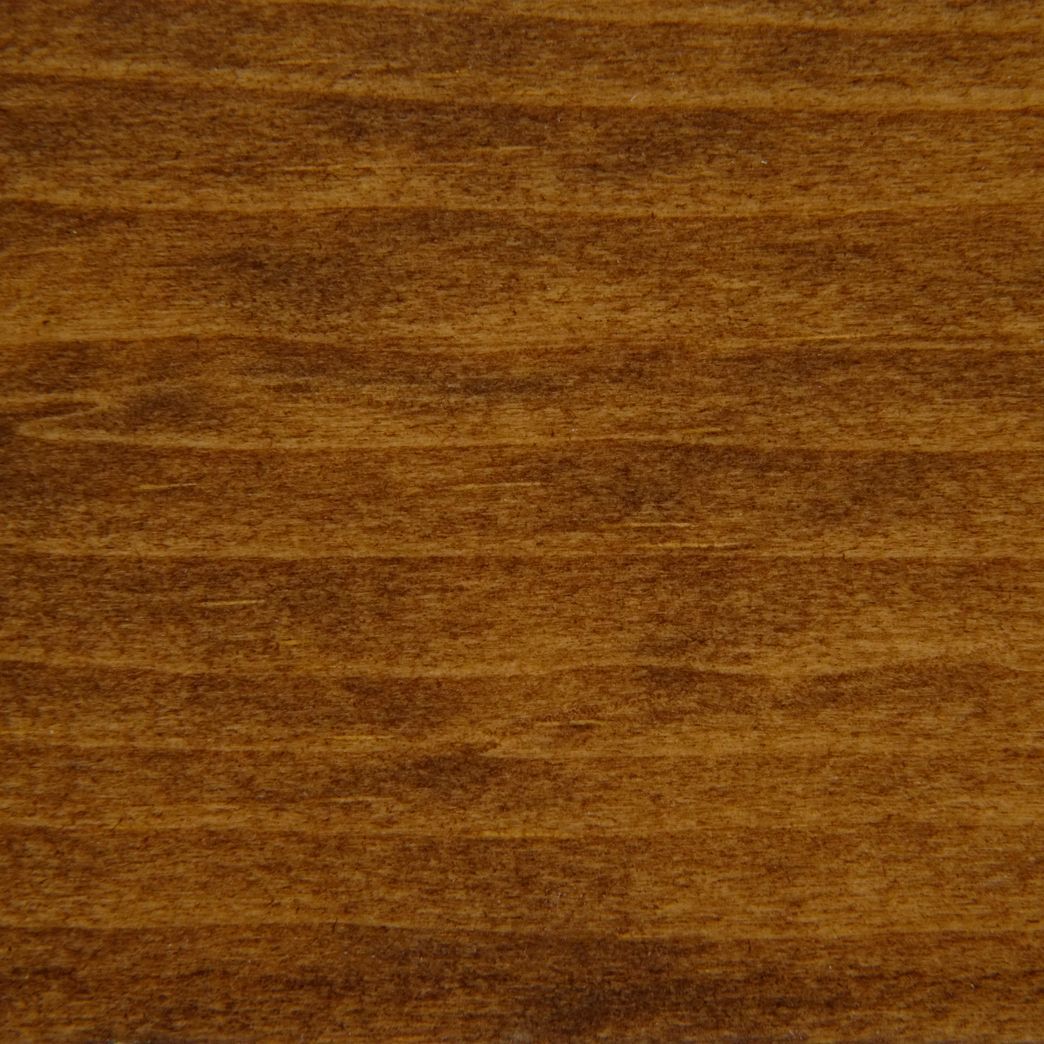 Un gros plan d'un morceau de bois montrant le grain et la texture.
